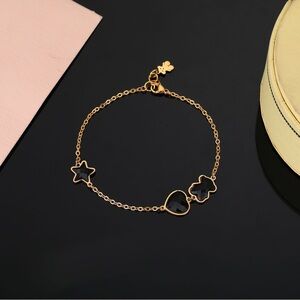 Tous Gold Bracelet with Black Star Charms